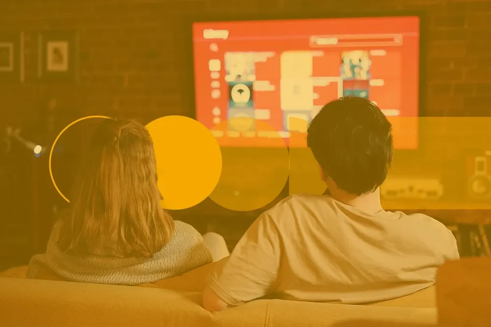 A Portuguese couple watching TV at night