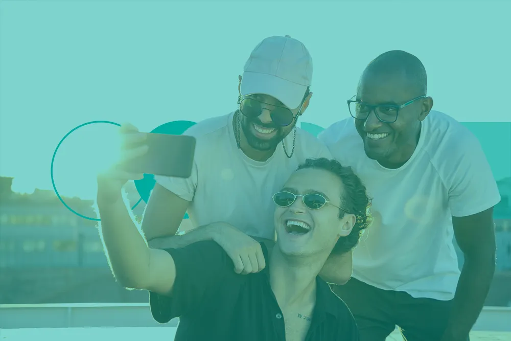 Three boys taking a selfie on their trip to Portugal